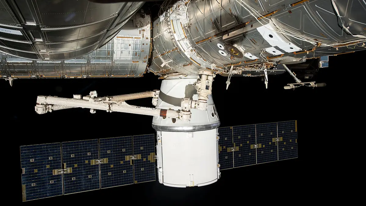 CRS-35 Dragon reaches the ISS with the station's final pair of roll-out solar arrays